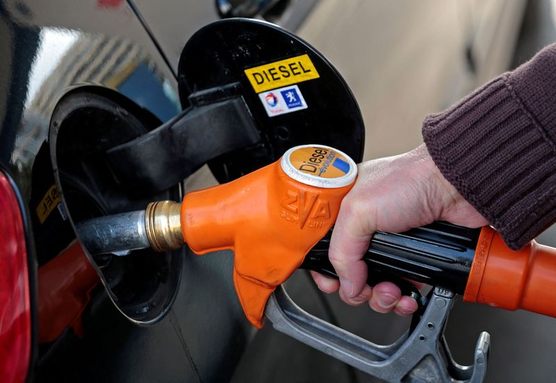 Oil prices slide, extending last week's decline
