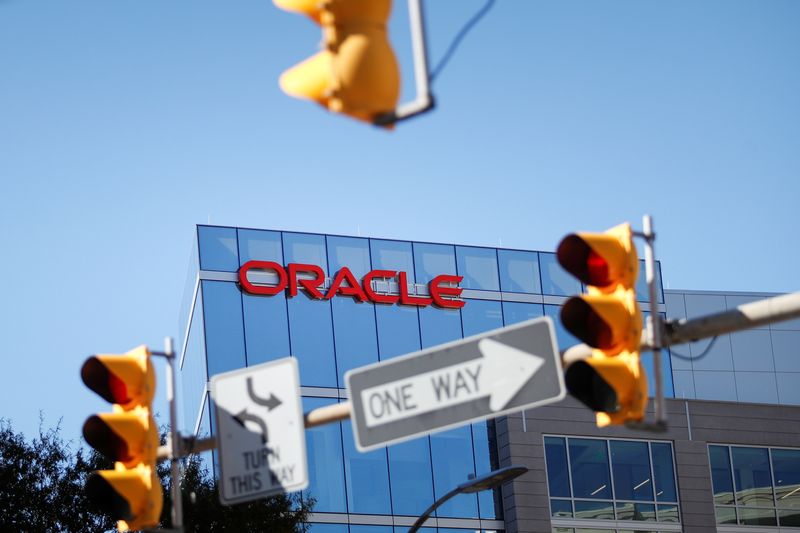 Oracle quarterly profit halves, shares fall
