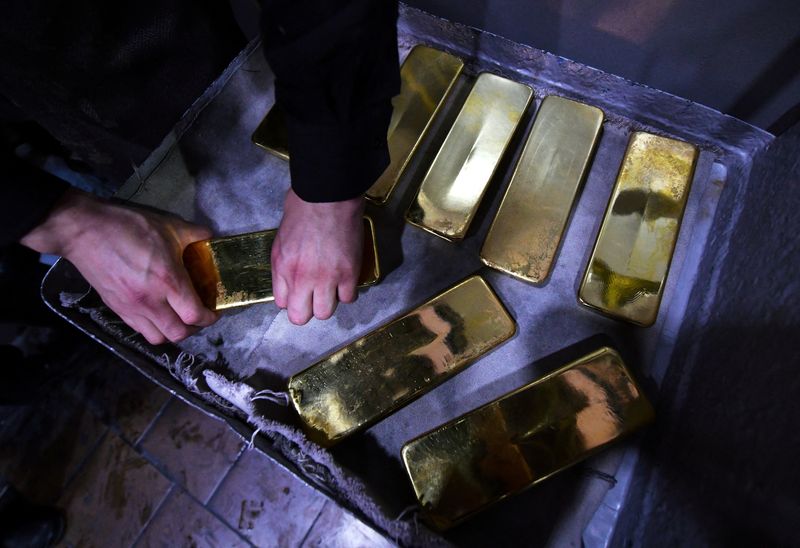 Russia shock hurls gold toward record highs