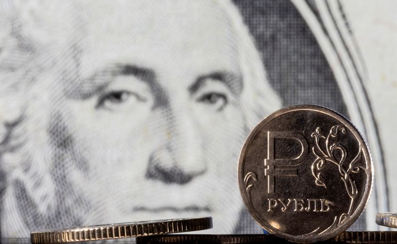 Russian rouble slips past 100 vs dollar, banks hunt for FX
