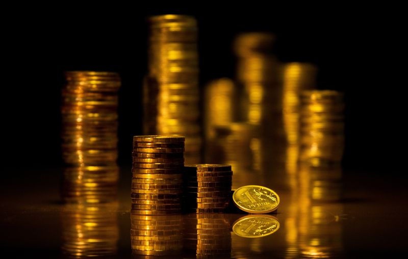 Russian rouble ticks up in thin volumes, outlook bleak