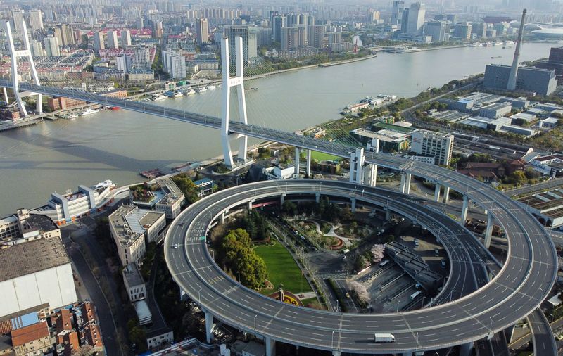 Shanghai expands COVID lockdown as new daily caseload surges by a third