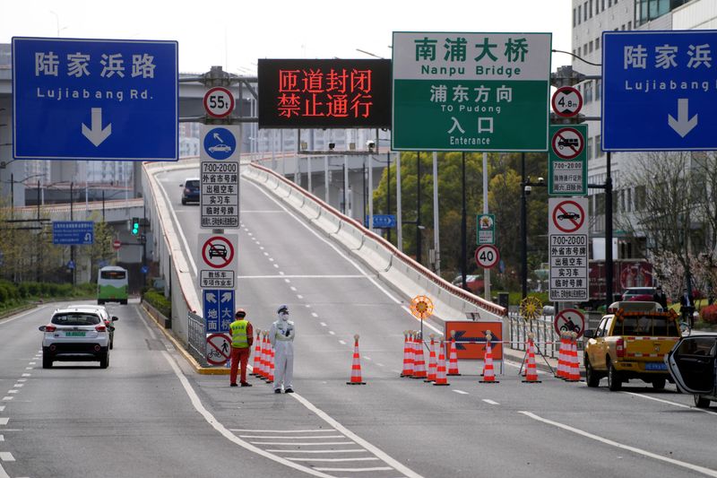 Shanghai tightens COVID lockdown on second day of curbs