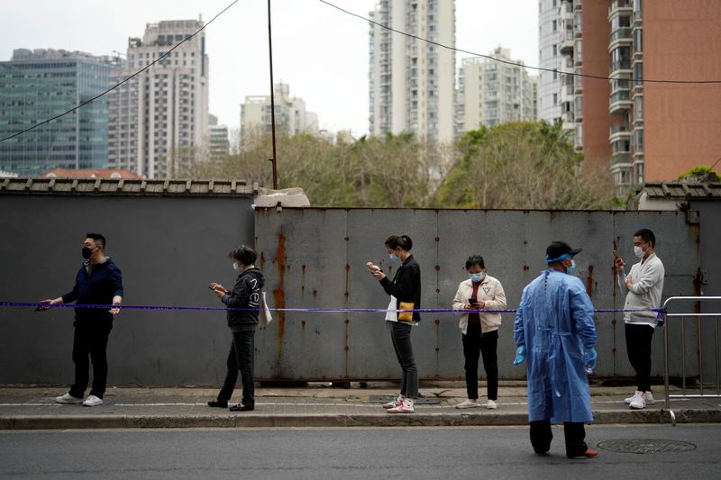 Shanghai urges COVID lockdown patience as case numbers drop for first time in 2 weeks