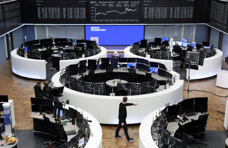 Shares edge higher in Europe after Fed hikes rate