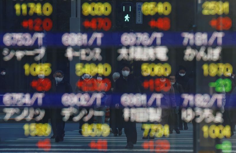 Asian stocks skid, bond yields rise after hawkish Fed comments