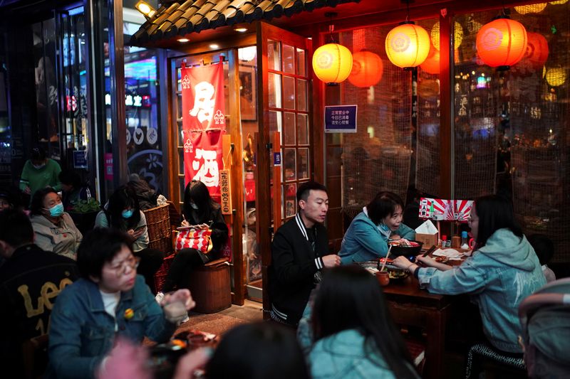 China's services sector activity squeezed by Omicron surge - Caixin PMI