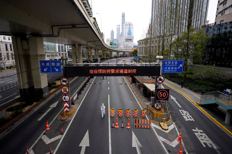 Chinese truckers left stranded for days at highway exit by hardline COVID curbs