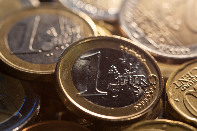 Euro inches up after Macron's victory, gains against bruised sterling