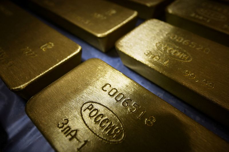 Gold eases as dollar, yields rise after hawkish Fed minutes