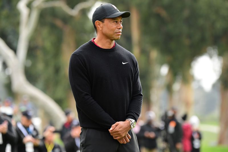 Golf-Woods heads to Augusta but still undecided on competing at Masters