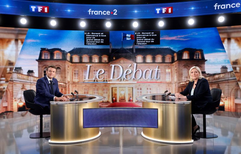 Macron, Le Pen back on campaign trail after heated debate
