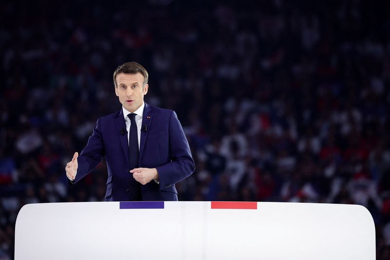 Macron hits out at 'racist' Le Pen as far-right candidate reaches all-time high in poll