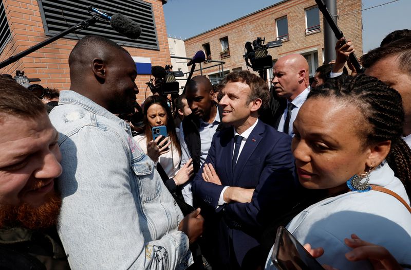 Macron, with eye on parliamentary poll, visits left-leaning Paris suburb