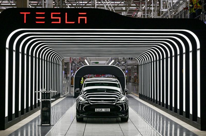Tesla beats revenue, profit estimates on record deliveries