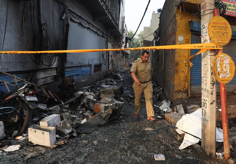 Building fire kills 27 in New Delhi, police arrest company owners