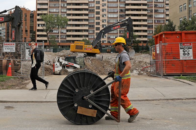 Canada gains 15,300 jobs in April, jobless rate edges down to 5.2%