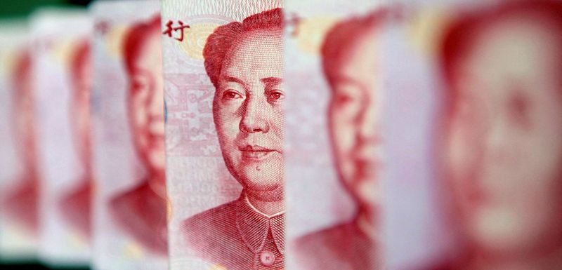 Chinese developers' debt woes worsen as sales, yuan weaken