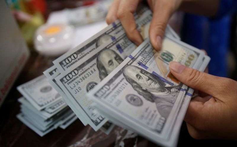 Dollar drifts toward monthly loss as Fed bets ease