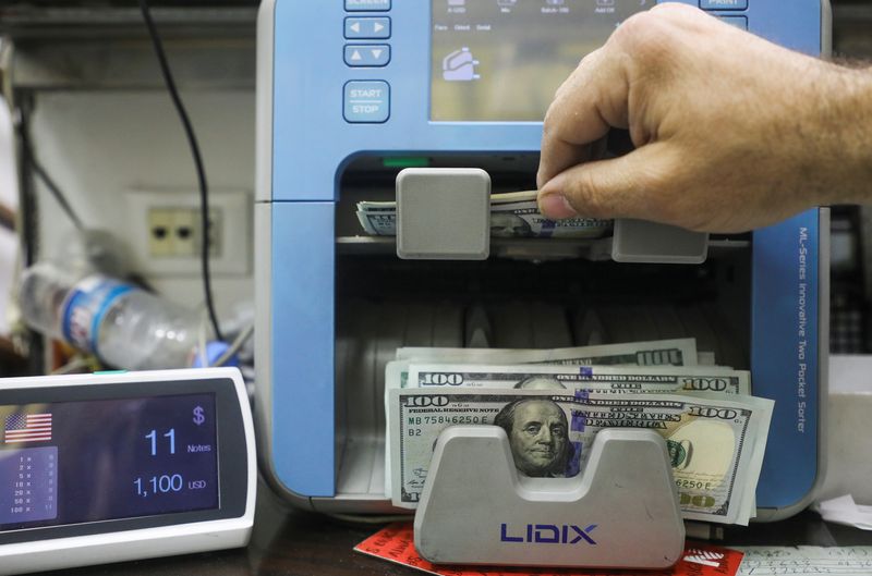 Dollar hovers near two-decade high as CPI keeps aggressive U.S. rate hikes likely