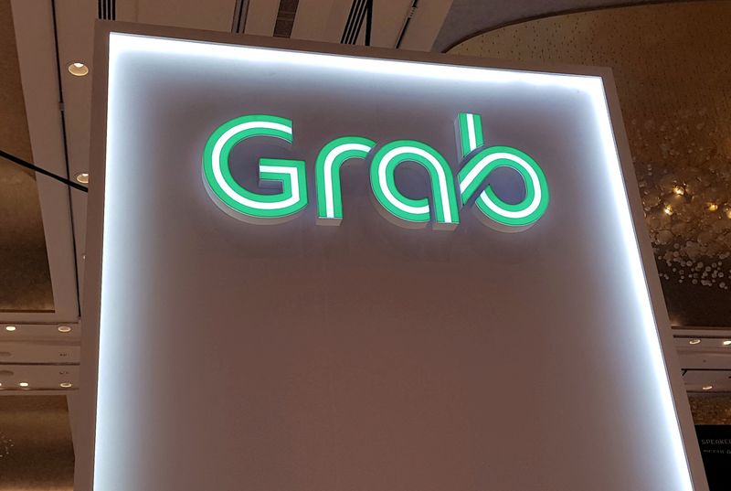 Exclusive-Two senior Grab executives quit as company rejigs unit to stem losses - sources
