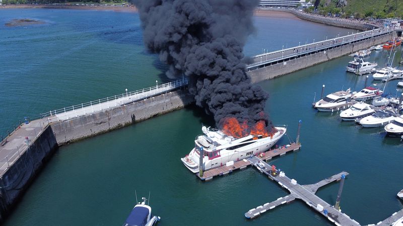 Fire engulfs superyacht in British marina