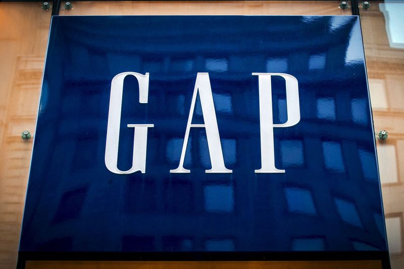 Futures inch up ahead of economic data, Gap slumps on outlook cut