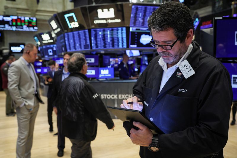 Futures slip as earnings disappoint, eyes on Fed