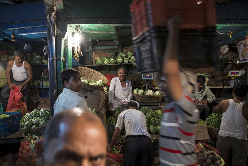 India's economic growth to slow if central bank hikes rates - official