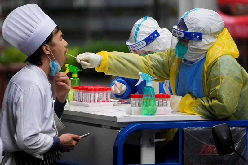 Shanghai hunkers down for final COVID battle, Beijing outbreak stubborn