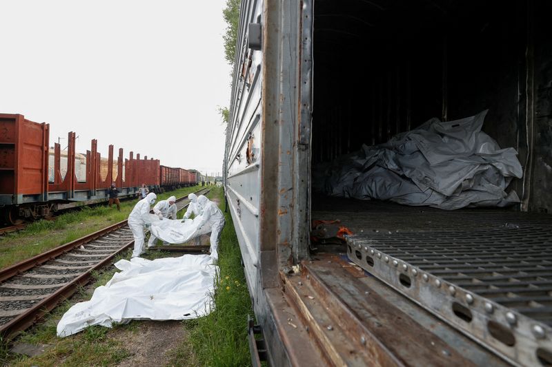Ukraine collects Russian dead as war rages on multiple fronts