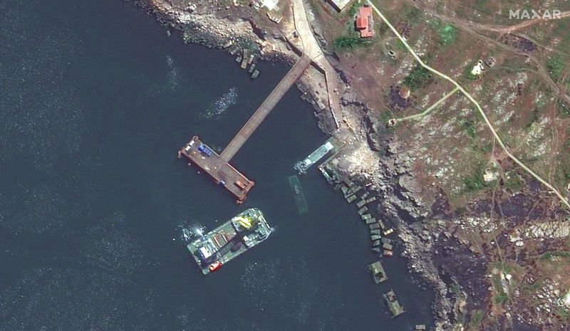 Ukraine says it damaged Russian ship, seeks evacuation of wounded Mariupol fighters
