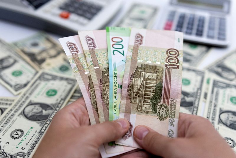 Russian rouble falls below 62 vs dollar on Friday trade